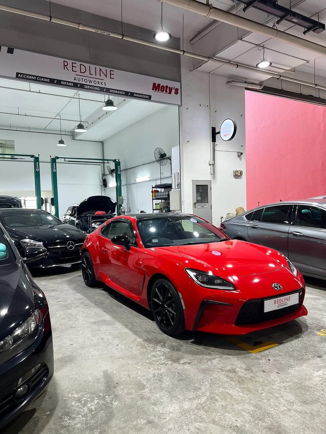 Red Toyota GR86 in the workshop